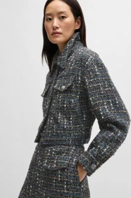 Chaqueta corta de tweed con botones de la marca