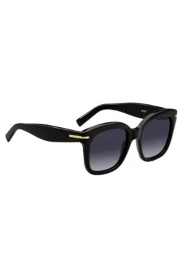 Gafas de sol de acetato negro con bisagras en tono dorado