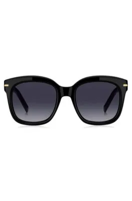 Gafas de sol de acetato negro con bisagras en tono dorado