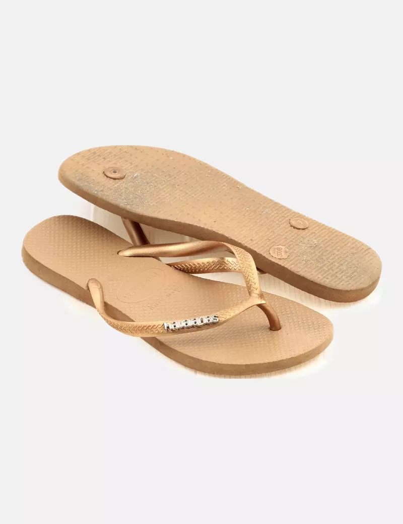 Havaianas Chanclas planas doradas