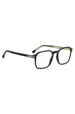 Montura para gafas graduadas en acetato negro con detalles en tono dorado