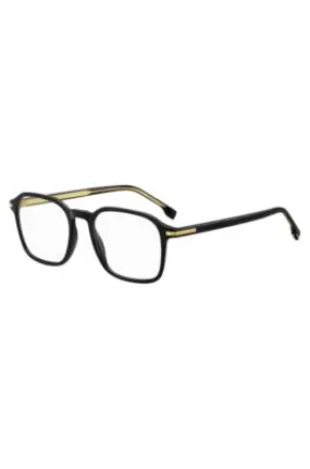 Montura para gafas graduadas en acetato negro con detalles en tono dorado