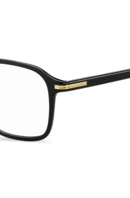 Montura para gafas graduadas en acetato negro con detalles en tono dorado